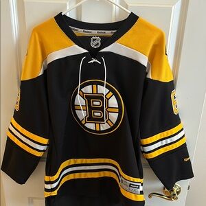 Reebok Bruins Hockey Jersey with Team Logo and Lace-Up Collar